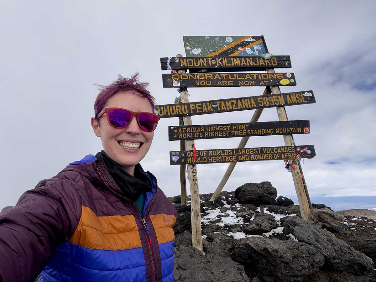 Jessi at the top of Mount Kilimanjaro